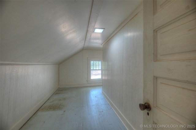 234 E Freeport St, Broken Arrow, OK 74012 - bonus room with vaulted ceiling, light wood-style floors, baseboards, and wooden walls