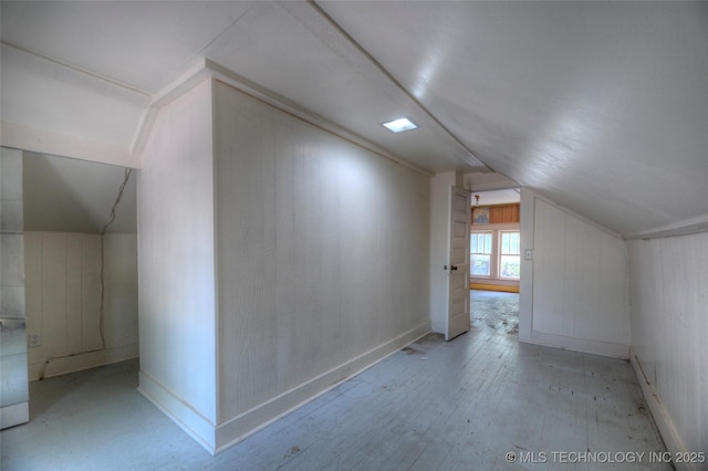 234 E Freeport St, Broken Arrow, OK 74012 - bonus room featuring vaulted ceiling, hardwood / wood-style floors, and wood walls