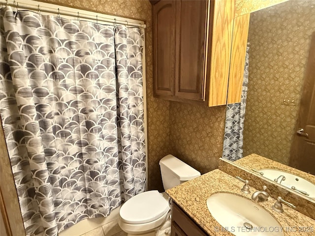 4224 S 69th W Ave, Tulsa, OK 74107 - bathroom with wallpapered walls, vanity, and toilet