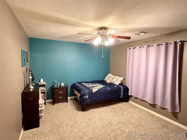 4224 S 69th W Ave, Tulsa, OK 74107 - carpeted bedroom featuring baseboards, a textured ceiling, and a ceiling fan