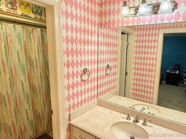4224 S 69th W Ave, Tulsa, OK 74107 - bathroom with wallpapered walls and vanity