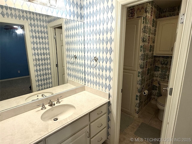 4224 S 69th W Ave, Tulsa, OK 74107 - full bathroom featuring wallpapered walls, vanity, toilet, and tile patterned flooring