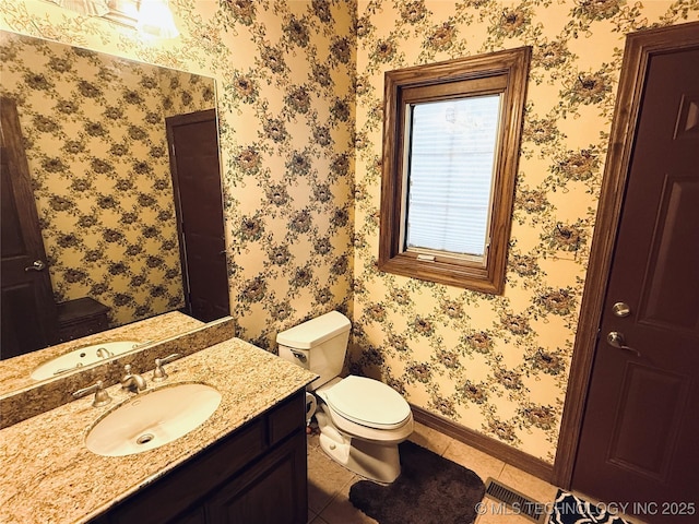 4224 S 69th W Ave, Tulsa, OK 74107 - half bath featuring baseboards, vanity, tile patterned flooring, and toilet