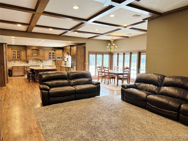 4224 S 69th W Ave, Tulsa, OK 74107 - living room featuring coffered ceiling, a chandelier, light wood finished floors, beam ceiling, and recessed lighting