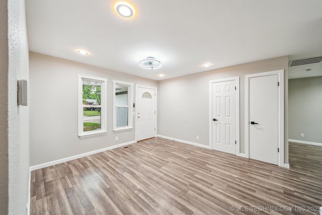 602 S Sunset Dr, Claremore, OK 74017 - unfurnished room featuring wood finished floors, baseboards, and recessed lighting