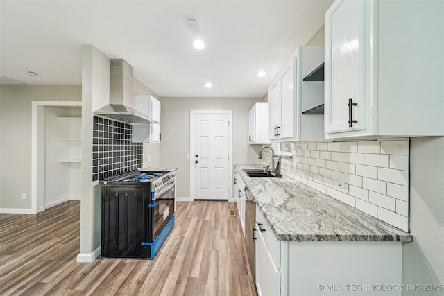 602 S Sunset Dr, Claremore, OK 74017 - kitchen with wall chimney range hood, a sink, stove, open shelves, and baseboards