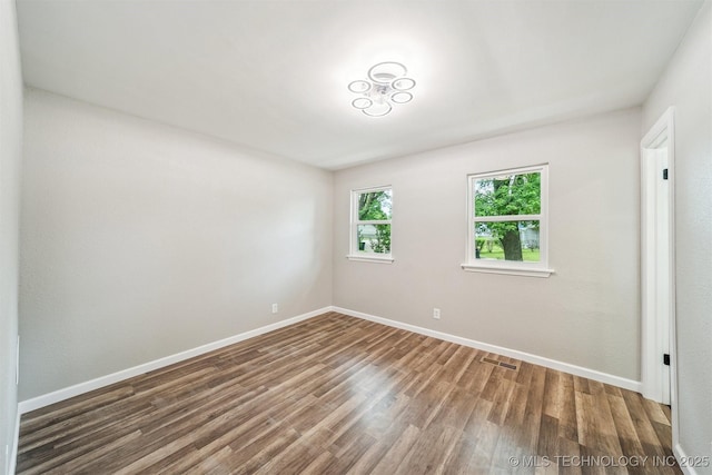 602 S Sunset Dr, Claremore, OK 74017 - unfurnished room with wood finished floors and baseboards