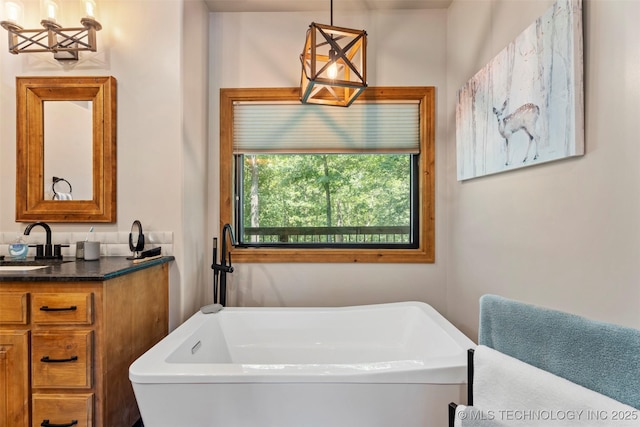 33268 Cardinal Dr, Afton, OK 74331 - full bathroom with vanity, a bath, and a chandelier