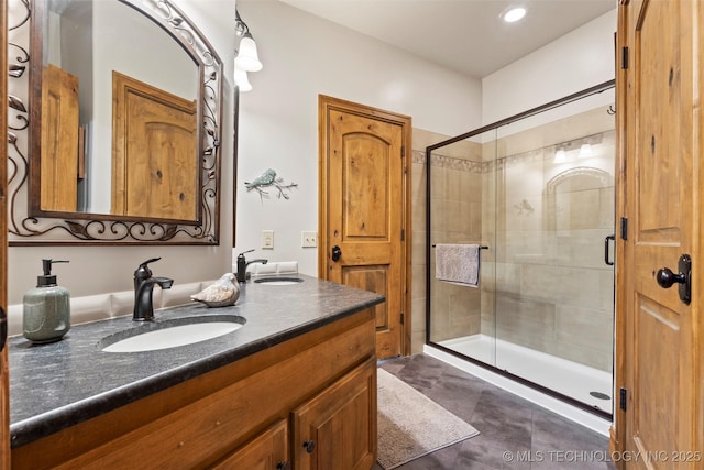 33268 Cardinal Dr, Afton, OK 74331 - full bath with double vanity, a shower stall, and recessed lighting