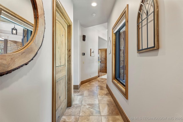 33268 Cardinal Dr, Afton, OK 74331 - hall featuring baseboards, stone tile flooring, and recessed lighting