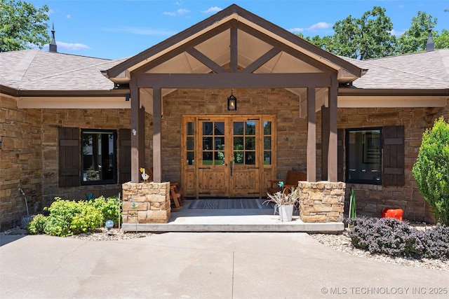 33268 Cardinal Dr, Afton, OK 74331 - property entrance featuring stone siding, covered porch, and a shingled roof