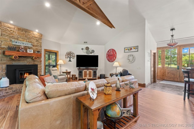 33268 Cardinal Dr, Afton, OK 74331 - living area featuring light wood finished floors, a stone fireplace, baseboards, and recessed lighting