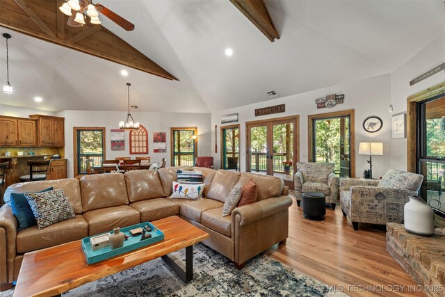 33268 Cardinal Dr, Afton, OK 74331 - living area with beam ceiling, light wood finished floors, a chandelier, recessed lighting, and high vaulted ceiling