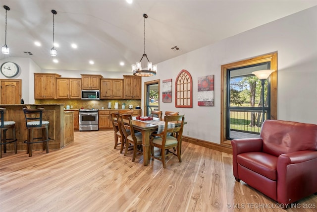33268 Cardinal Dr, Afton, OK 74331 - dining space with light wood-style floors, a chandelier, baseboards, lofted ceiling, and recessed lighting