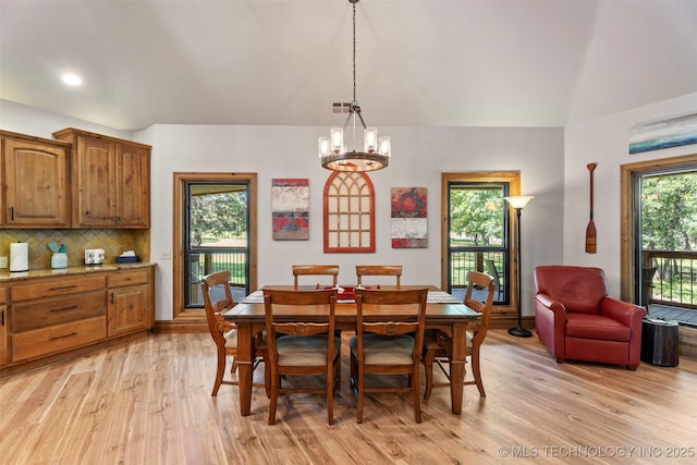 33268 Cardinal Dr, Afton, OK 74331 - dining room with light wood-style flooring, a chandelier, vaulted ceiling, recessed lighting, and baseboards