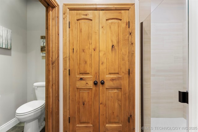 33268 Cardinal Dr, Afton, OK 74331 - bathroom featuring a closet, toilet, a shower stall, and baseboards