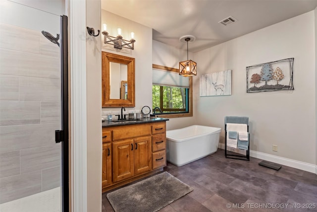 33268 Cardinal Dr, Afton, OK 74331 - full bathroom featuring vanity, a freestanding tub, and a stall shower