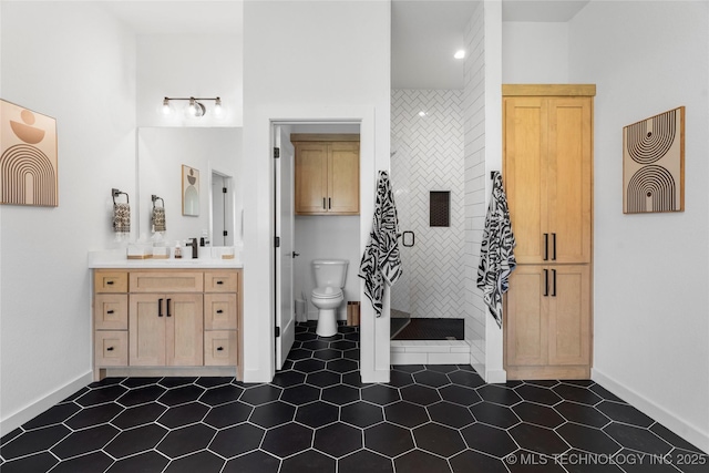 7408 E College St, Broken Arrow, OK 74014 - bathroom featuring vanity, a stall shower, baseboards, and toilet