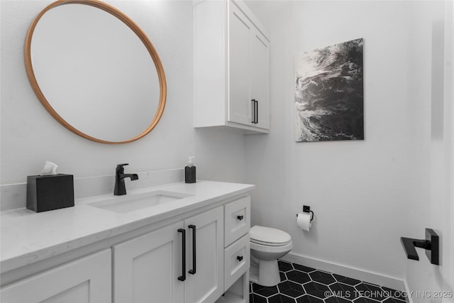 7408 E College St, Broken Arrow, OK 74014 - bathroom featuring vanity, toilet, baseboards, and tile patterned flooring