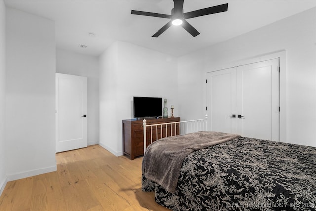 7408 E College St, Broken Arrow, OK 74014 - bedroom featuring light wood-style floors, baseboards, ceiling fan, and a closet