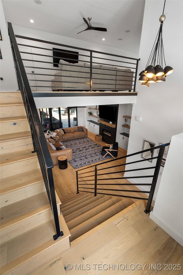 7408 E College St, Broken Arrow, OK 74014 - stairway with wood finished floors, baseboards, a ceiling fan, and recessed lighting