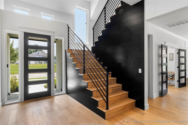 7408 E College St, Broken Arrow, OK 74014 - entrance foyer with wood finished floors, stairs, and ornamental molding