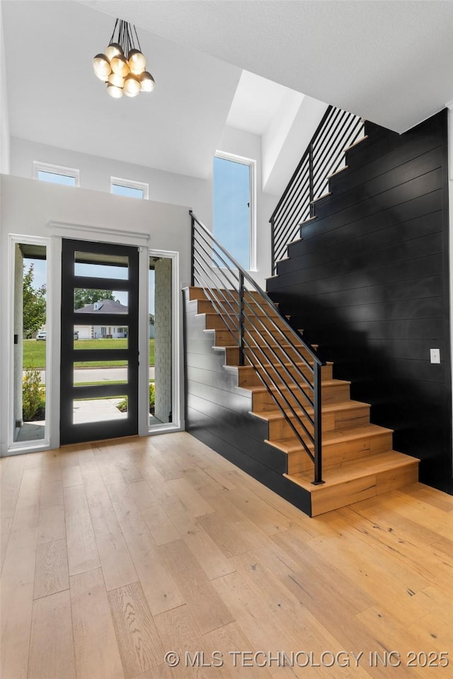 7408 E College St, Broken Arrow, OK 74014 - entryway with stairs, a chandelier, and hardwood / wood-style floors