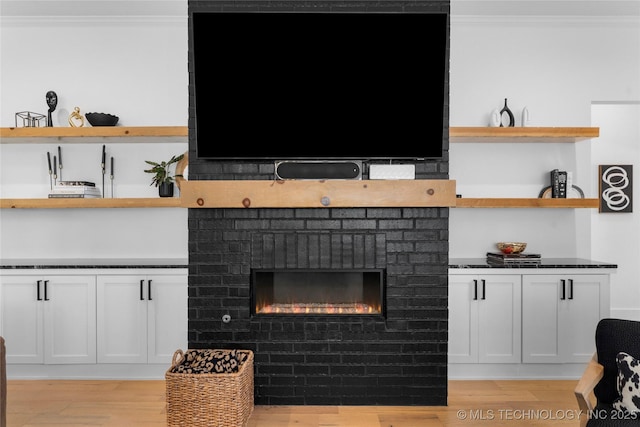 7408 E College St, Broken Arrow, OK 74014 - detailed view of ornamental molding, wood finished floors, and a fireplace