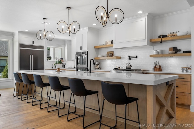 7408 E College St, Broken Arrow, OK 74014 - kitchen featuring open shelves, a sink, tasteful backsplash, light countertops, and healthy amount of natural light