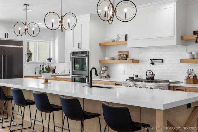 7408 E College St, Broken Arrow, OK 74014 - kitchen with double oven, open shelves, a sink, and a chandelier