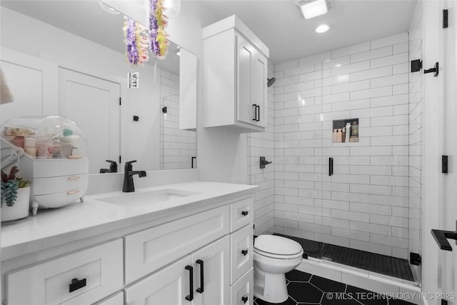 7408 E College St, Broken Arrow, OK 74014 - bathroom with vanity, a stall shower, toilet, tile patterned floors, and recessed lighting