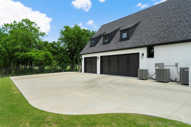 7408 E College St, Broken Arrow, OK 74014 - view of home's exterior with cooling unit, a garage, and a shingled roof