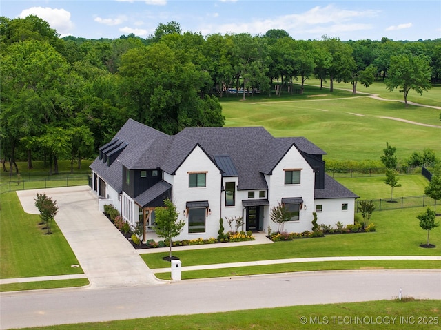 7408 E College St, Broken Arrow, OK 74014 - view of front of house with driveway, a shingled roof, a garage, and a standing seam roof