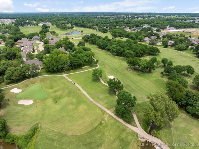 7408 E College St, Broken Arrow, OK 74014 - aerial view of residential area featuring a large body of water, a golf course, and a tree filled landscape