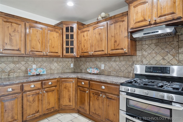 12523 S Cedar Pl, Jenks, OK 74037 - kitchen featuring range with two ovens, brown cabinets, and light tile patterned flooring