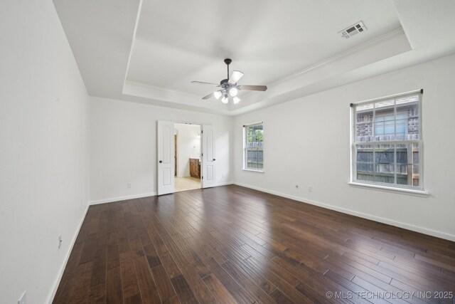 12523 S Cedar Pl, Jenks, OK 74037 - unfurnished bedroom featuring a raised ceiling, wood finished floors, crown molding, ensuite bathroom, and a ceiling fan