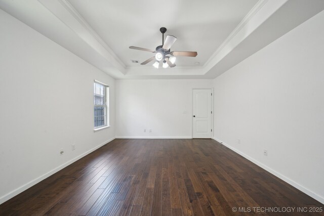 12523 S Cedar Pl, Jenks, OK 74037 - empty room featuring a tray ceiling, a ceiling fan, dark wood-style floors, and ornamental molding
