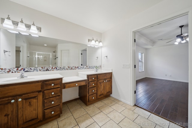 12523 S Cedar Pl, Jenks, OK 74037 - bathroom featuring double vanity, a shower stall, a ceiling fan, and tile patterned flooring