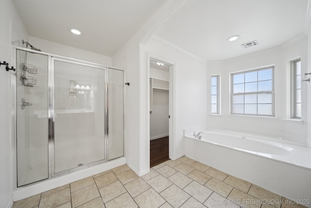 12523 S Cedar Pl, Jenks, OK 74037 - bathroom featuring a stall shower, a bath, a walk in closet, ornamental molding, and tile patterned floors
