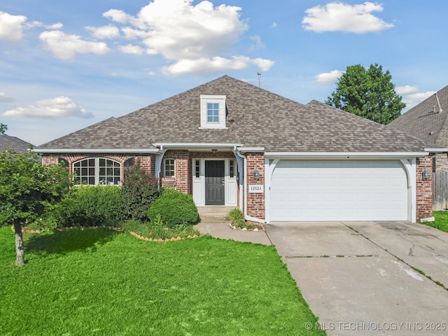 12523 S Cedar Pl, Jenks, OK 74037 - view of front of property with brick siding, driveway, a front yard, a garage, and roof with shingles