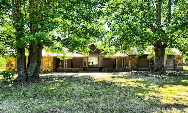 17079 S 125th St, Webbers Falls, OK 74470 - rear view of property with stone siding and a lawn