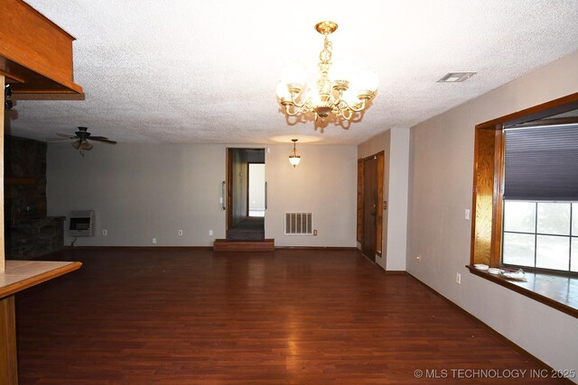 17079 S 125th St, Webbers Falls, OK 74470 - unfurnished living room featuring wood finished floors, a chandelier, ceiling fan, a textured ceiling, and heating unit