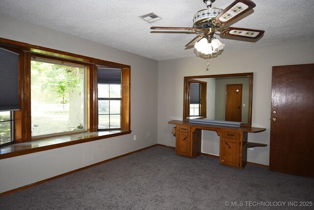 17079 S 125th St, Webbers Falls, OK 74470 - unfurnished bedroom with multiple windows, a textured ceiling, light colored carpet, and baseboards