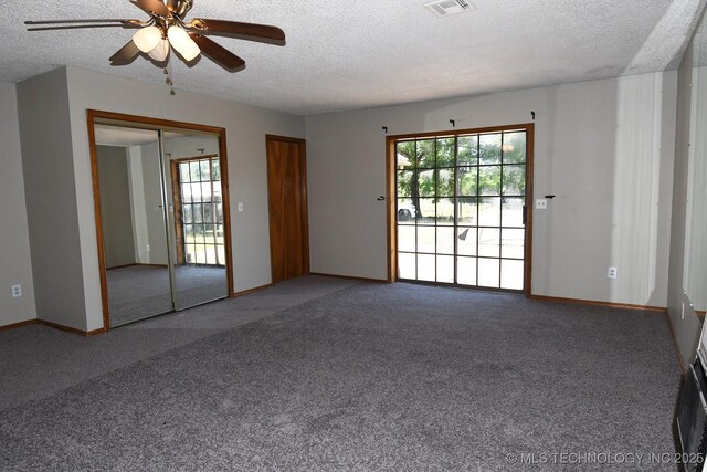 17079 S 125th St, Webbers Falls, OK 74470 - spare room featuring a textured ceiling, carpet flooring, ceiling fan, plenty of natural light, and baseboards