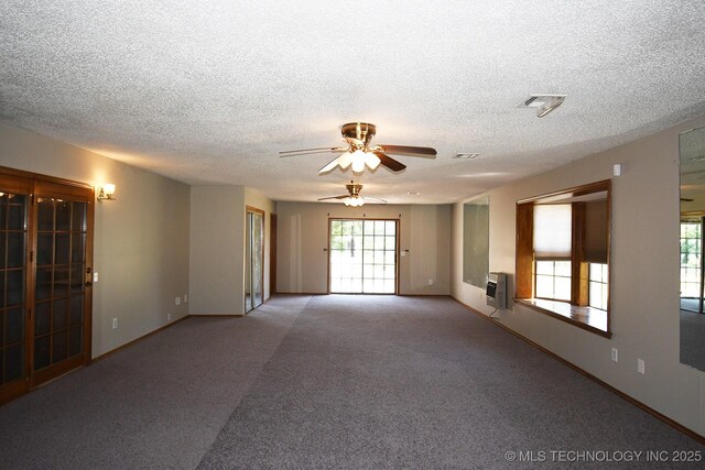 17079 S 125th St, Webbers Falls, OK 74470 - carpeted spare room with ceiling fan, heating unit, a textured ceiling, and baseboards
