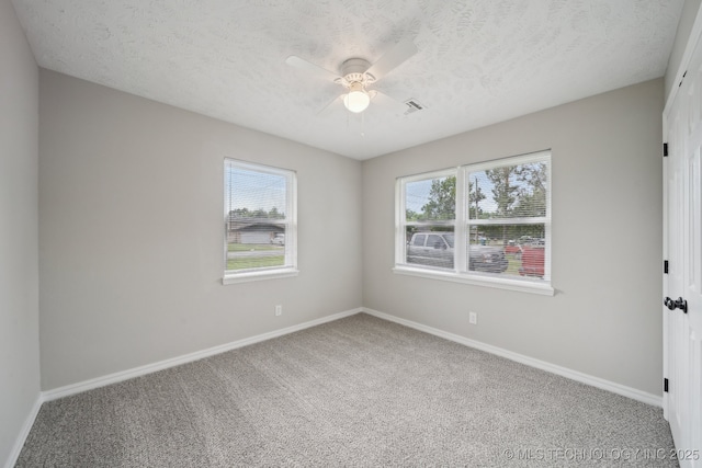128 Suburban Ln, Inola, OK 74036 - spare room with carpet flooring, baseboards, a textured ceiling, and a ceiling fan