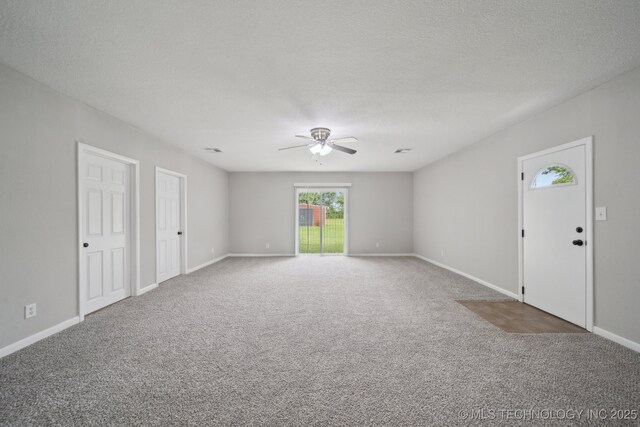 128 Suburban Ln, Inola, OK 74036 - carpeted empty room featuring a ceiling fan, baseboards, and a textured ceiling