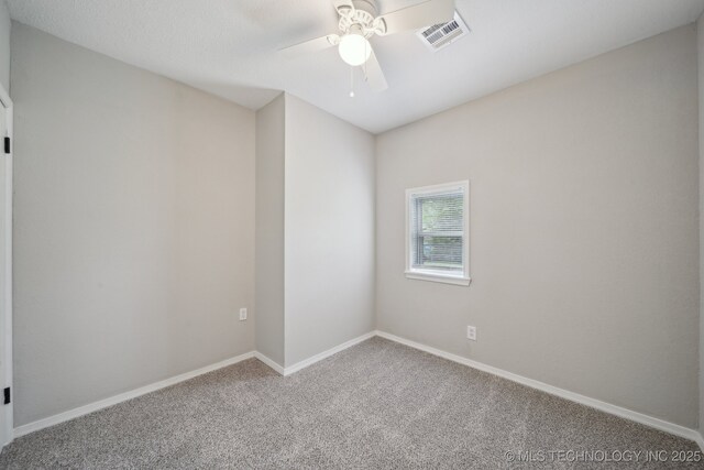 128 Suburban Ln, Inola, OK 74036 - carpeted empty room featuring a ceiling fan and baseboards