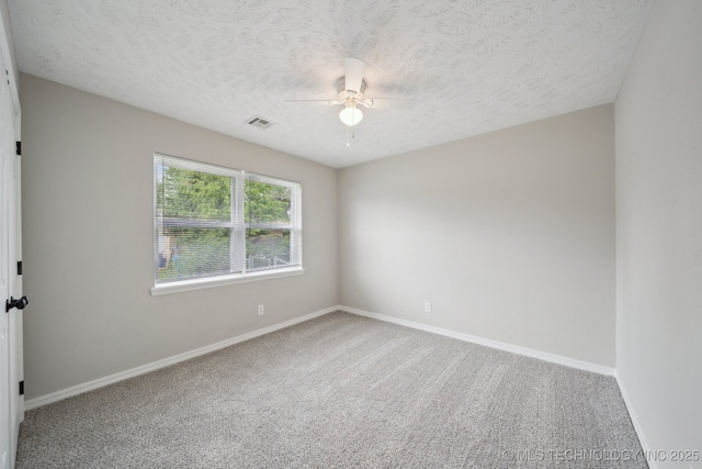 128 Suburban Ln, Inola, OK 74036 - carpeted spare room featuring ceiling fan, baseboards, and a textured ceiling