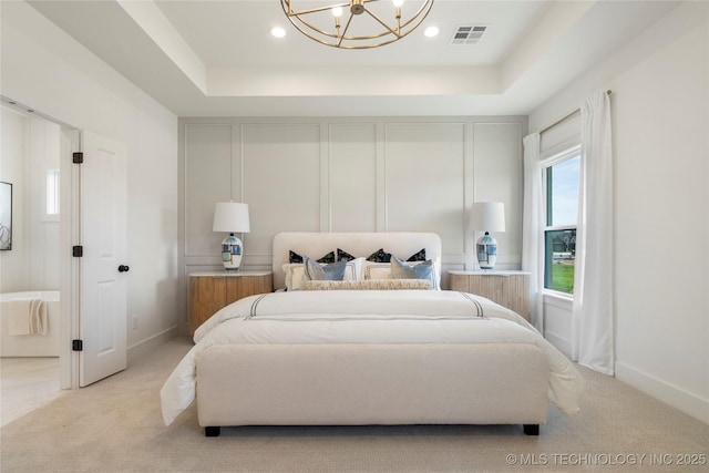 2338 E 134th St S, Bixby, OK 74008 - bedroom featuring light colored carpet, a chandelier, a tray ceiling, and recessed lighting